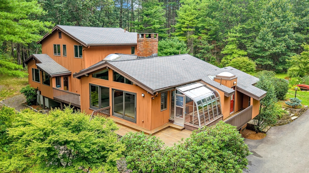57 South Street Natick, MA 01760 - Photo 29 of 36 an aerial view of a house with a yard and large trees