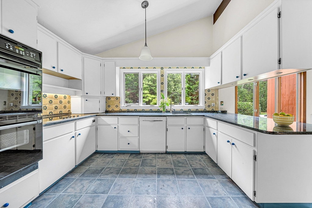 57 South Street Natick, MA 01760 - Photo 3 of 36 a kitchen with a stove window and cabinets