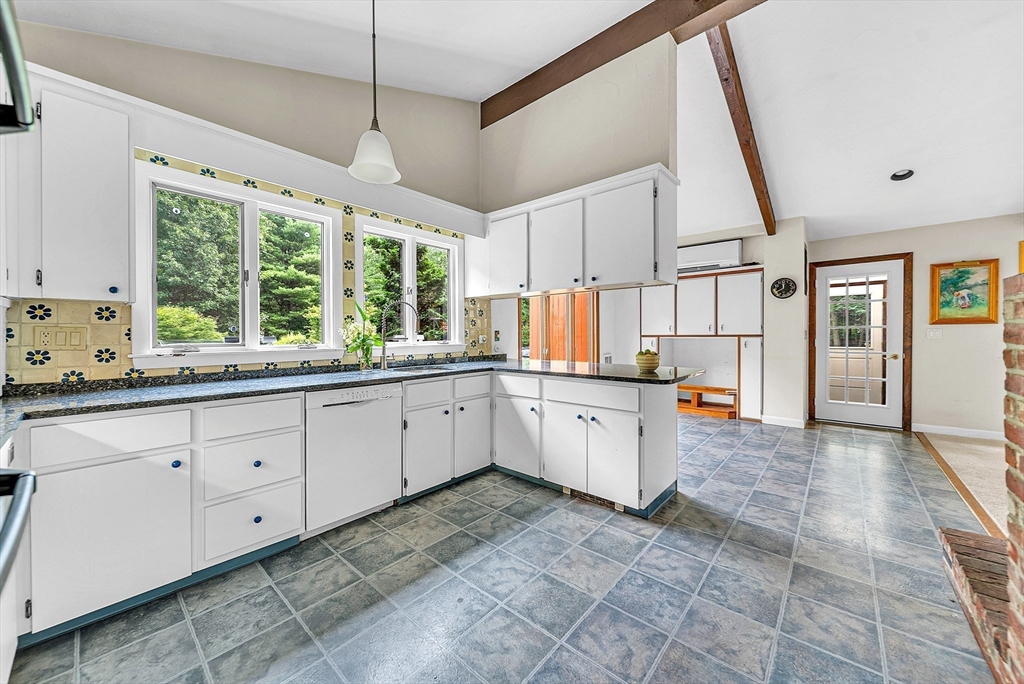57 South Street Natick, MA 01760 - Photo 4 of 36 a large white kitchen with a large window