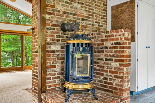 a front view of a house with a fountain