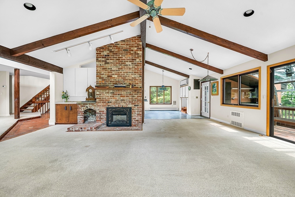 57 South Street Natick, MA 01760 - Photo 9 of 36 a view of a livingroom with an empty space and a fireplace