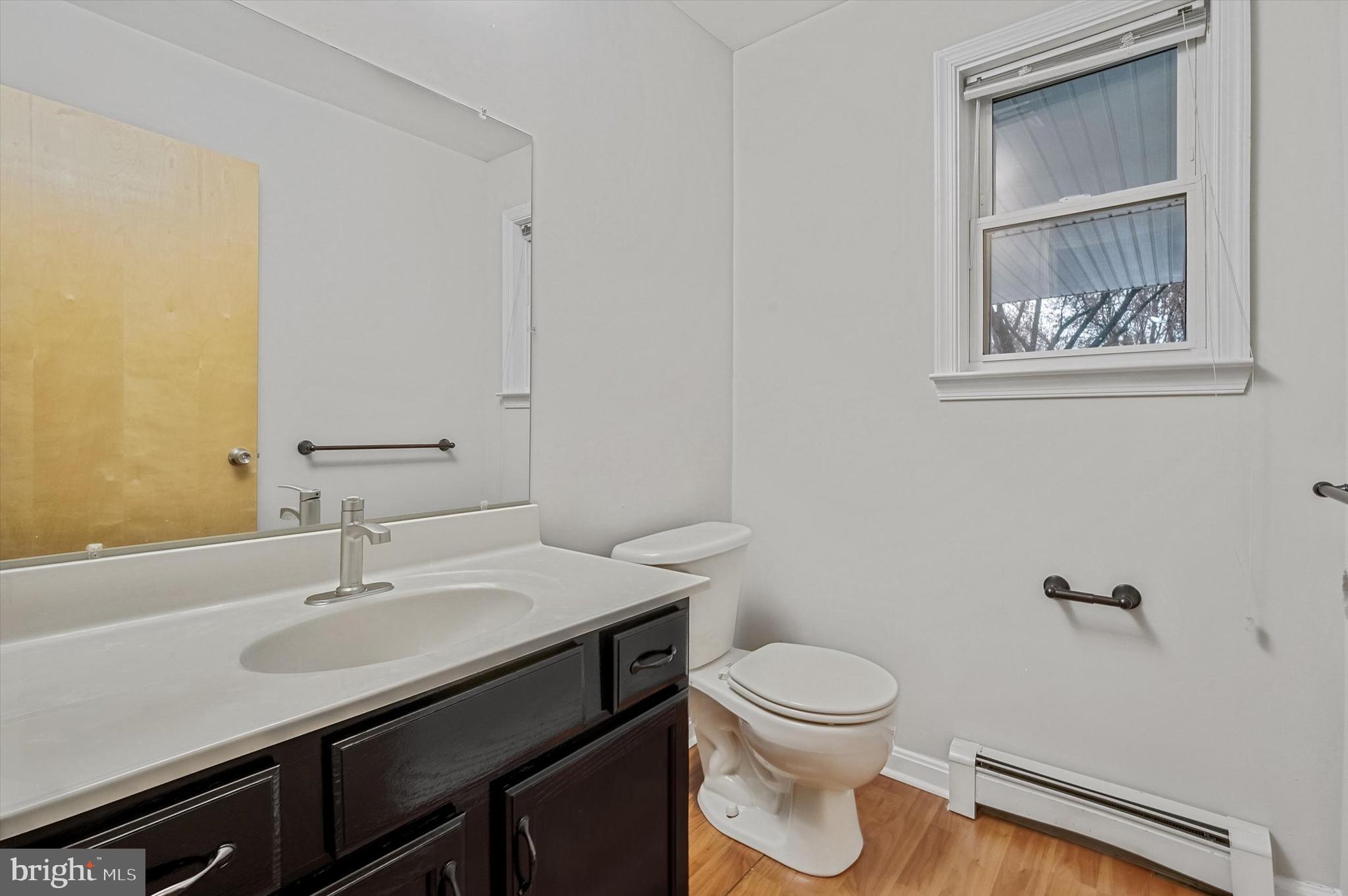 7510 Old Receiver Road Frederick, MD 21702 - Photo 13 of 57 a bathroom with a toilet a sink and mirror