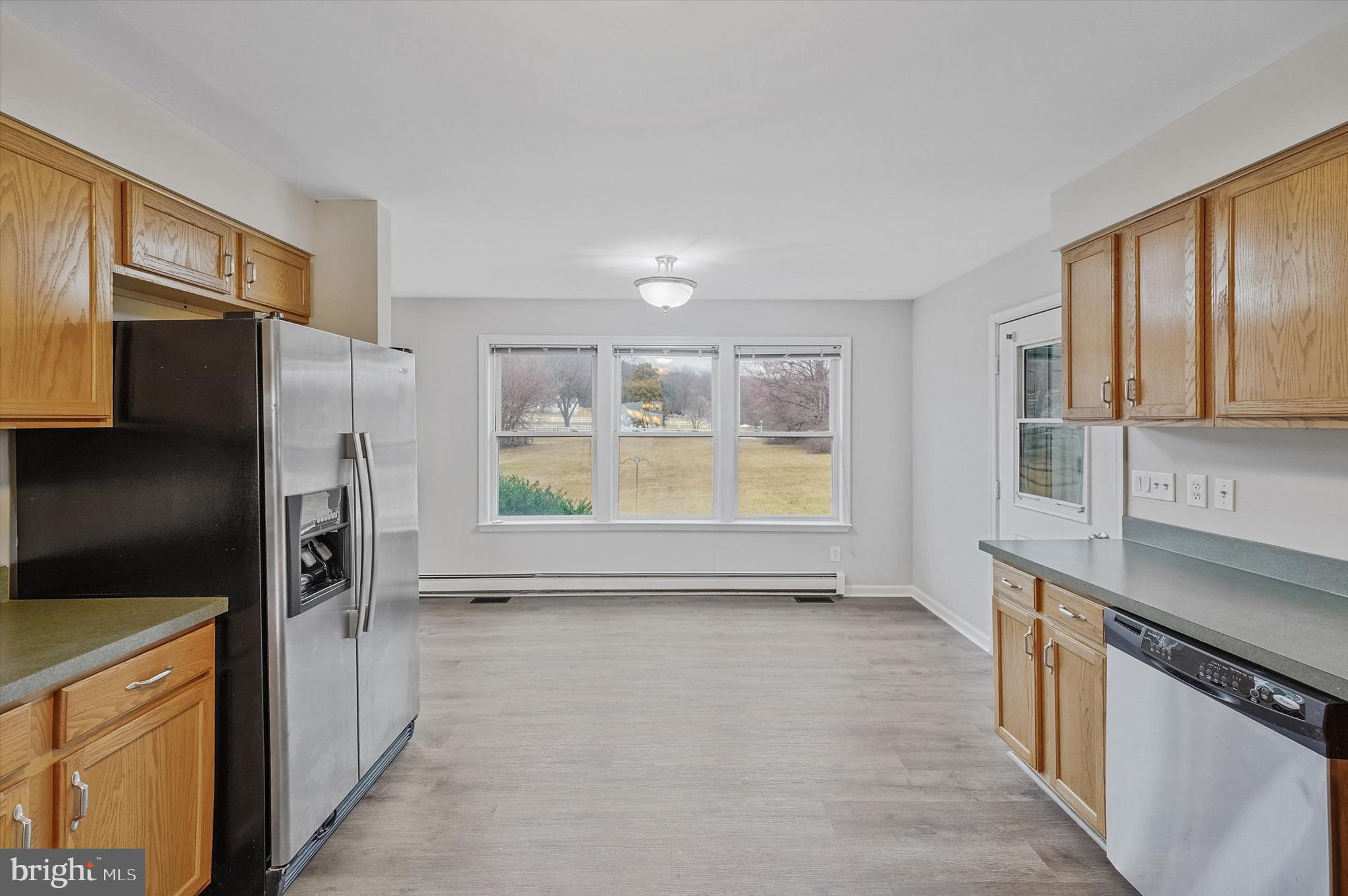 7510 Old Receiver Road Frederick, MD 21702 - Photo 14 of 57 a kitchen with stainless steel appliances a refrigerator and a stove top oven