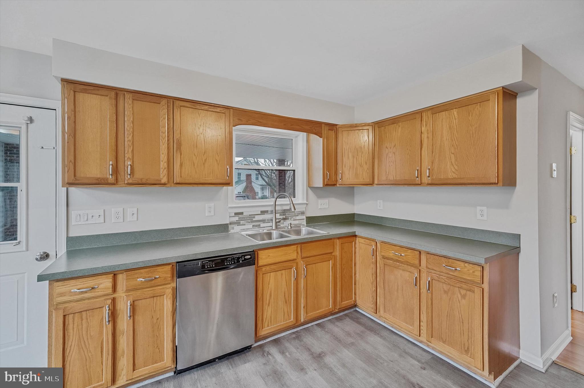 7510 Old Receiver Road Frederick, MD 21702 - Photo 15 of 57 a kitchen with stainless steel appliances granite countertop a sink a stove cabinets and wooden floor