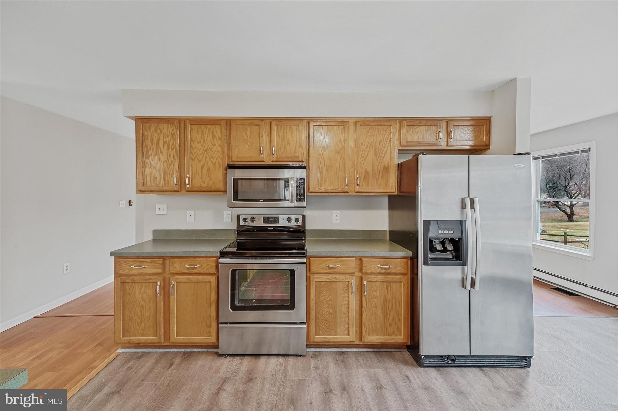7510 Old Receiver Road Frederick, MD 21702 - Photo 16 of 57 a kitchen with a refrigerator stove and wooden floor