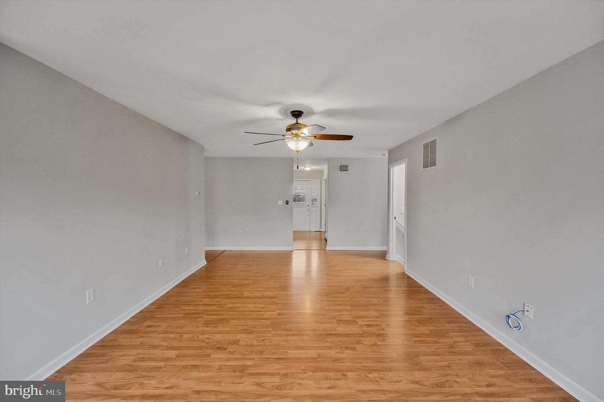 7510 Old Receiver Road Frederick, MD 21702 - Photo 20 of 57 a view of an empty room with chandelier fan and wooden floor