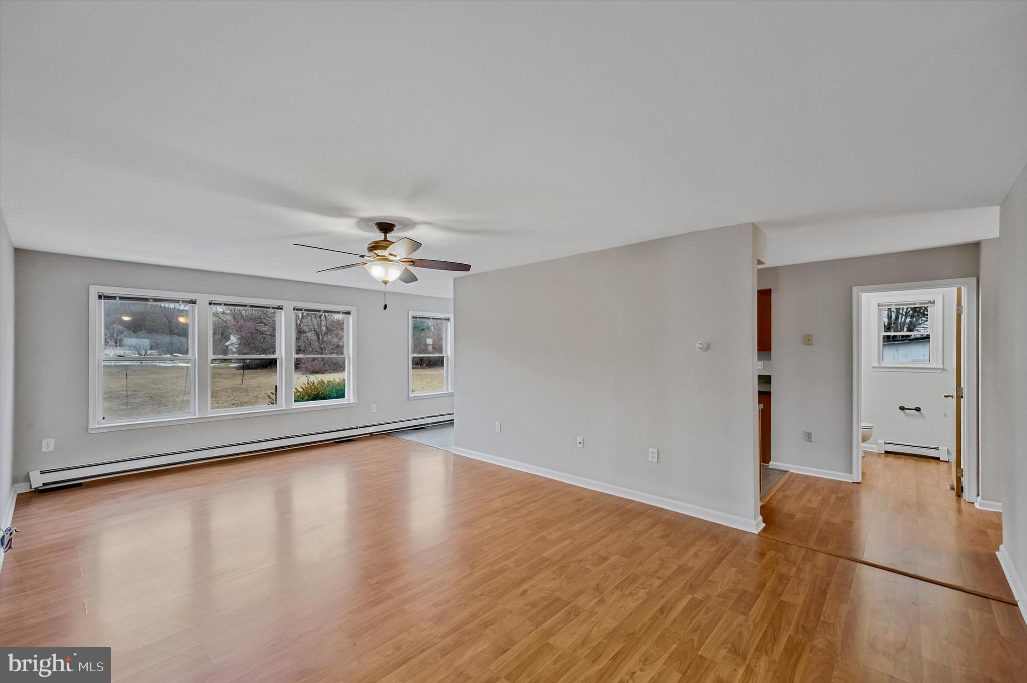 7510 Old Receiver Road Frederick, MD 21702 - Photo 23 of 57 a view of an empty room with a window and wooden floor