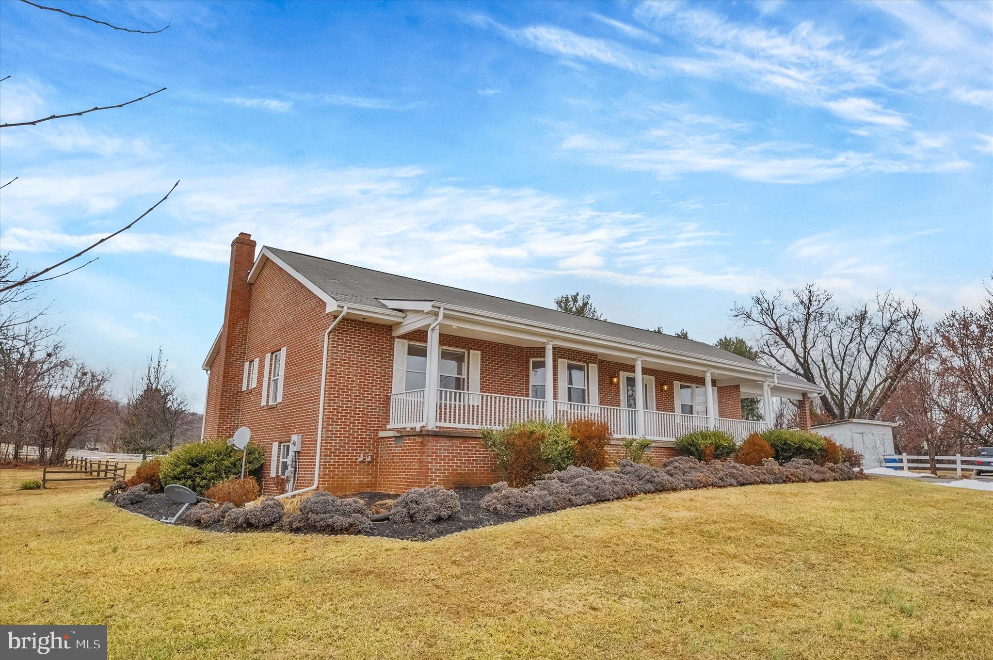 7510 Old Receiver Road Frederick, MD 21702 - Photo 3 of 57 a front view of house with yard and trees around