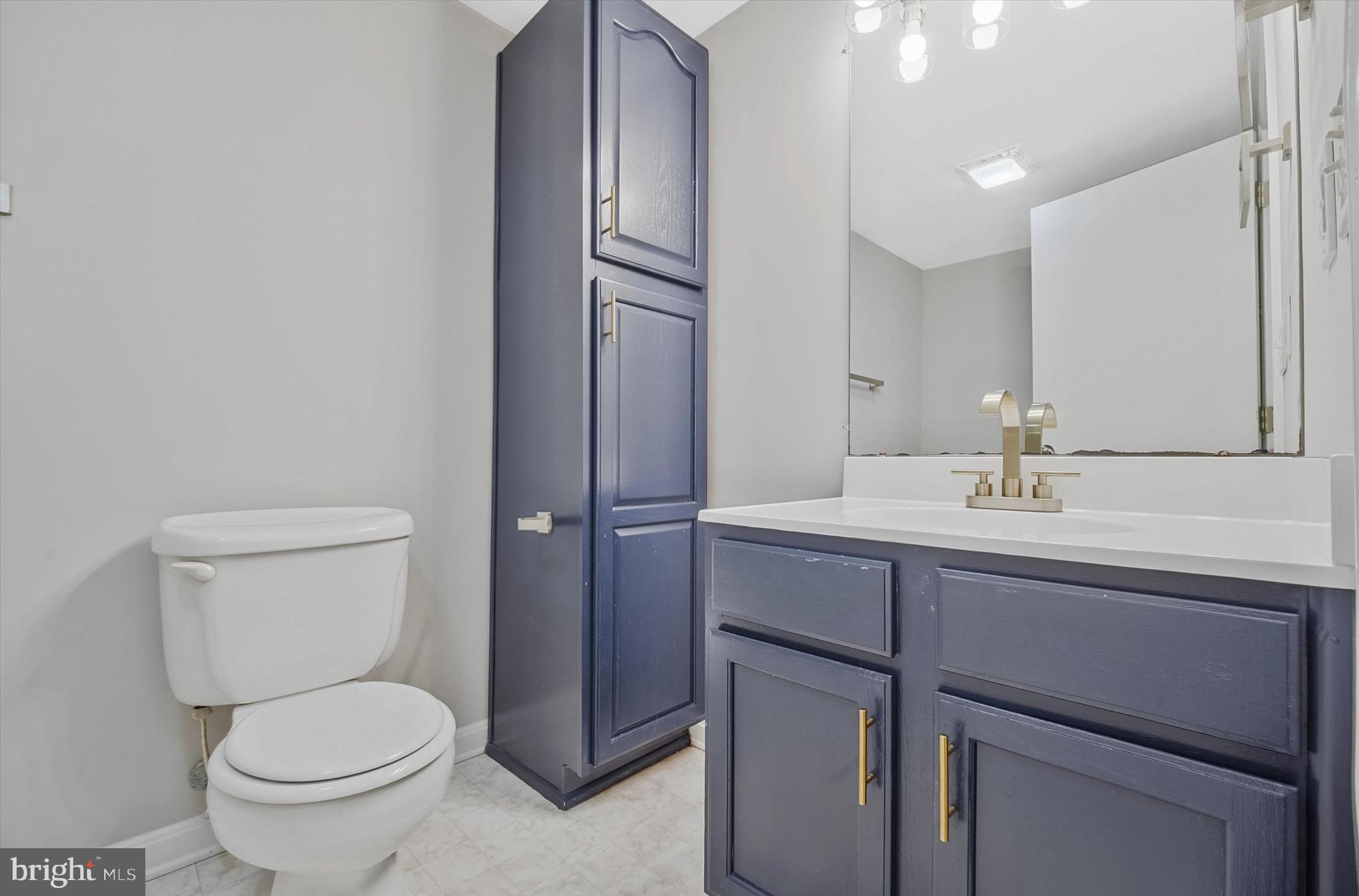 7510 Old Receiver Road Frederick, MD 21702 - Photo 40 of 57 a bathroom with a toilet a sink and mirror