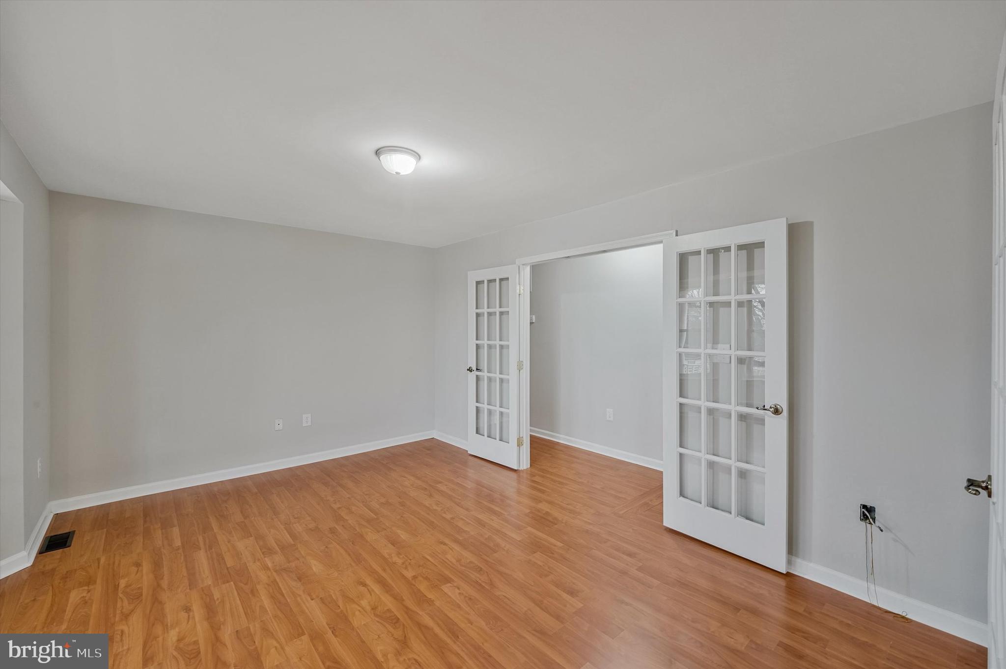 7510 Old Receiver Road Frederick, MD 21702 - Photo 6 of 57 wooden floor in an empty room with a window