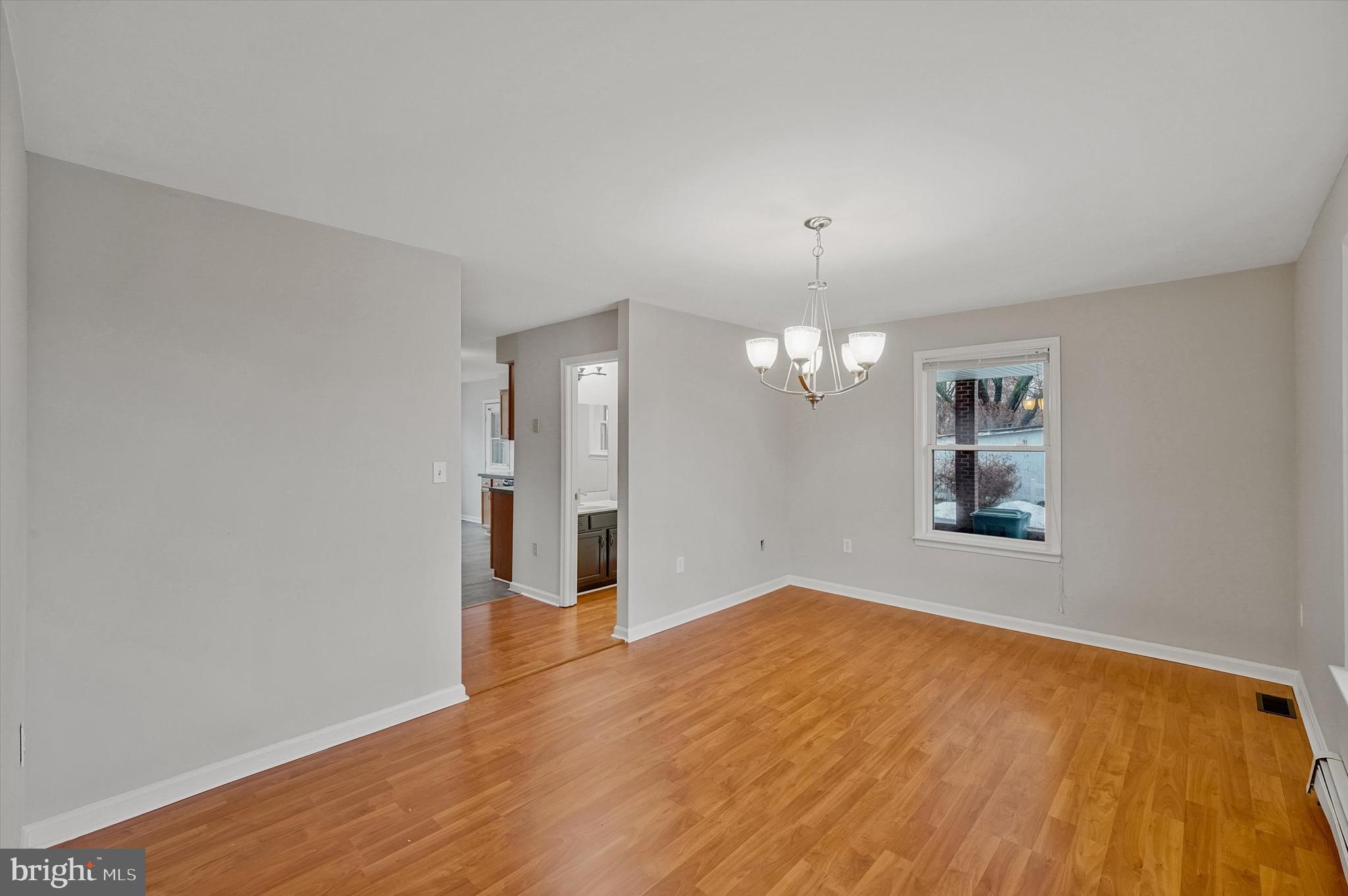 7510 Old Receiver Road Frederick, MD 21702 - Photo 9 of 57 an empty room with wooden floor and windows