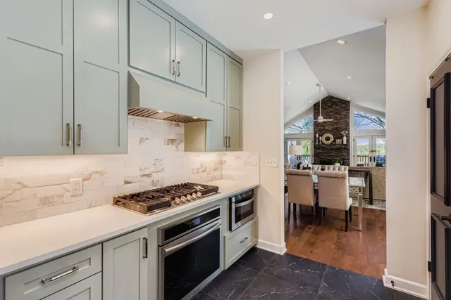 a kitchen with cabinets and appliances