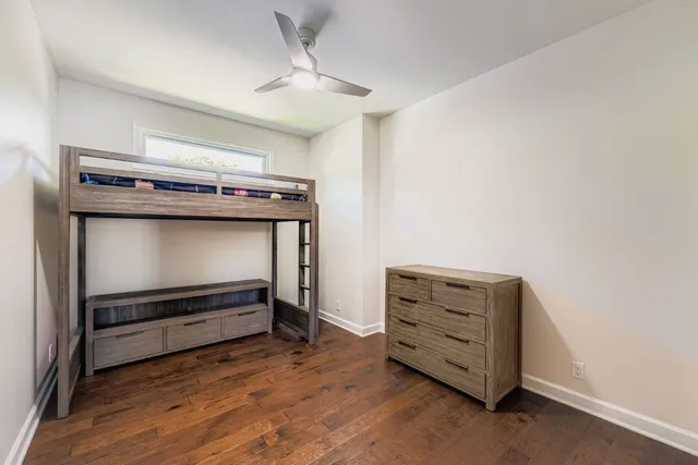 a view of room with wooden floor