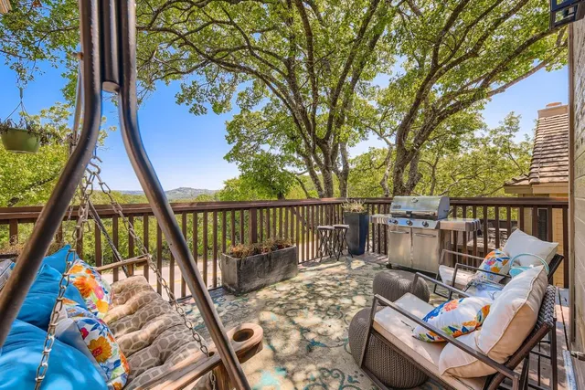 a view of balcony with furniture