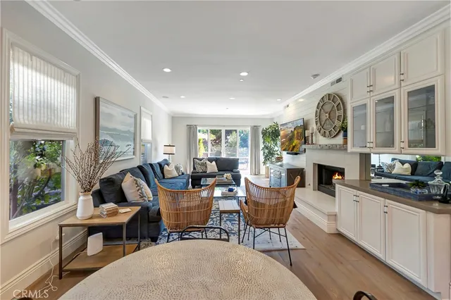 a view of a dining room with furniture wooden floor and chandelier