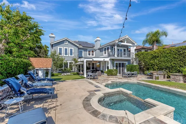 a view of a wooden dinning table and chairs in the patio