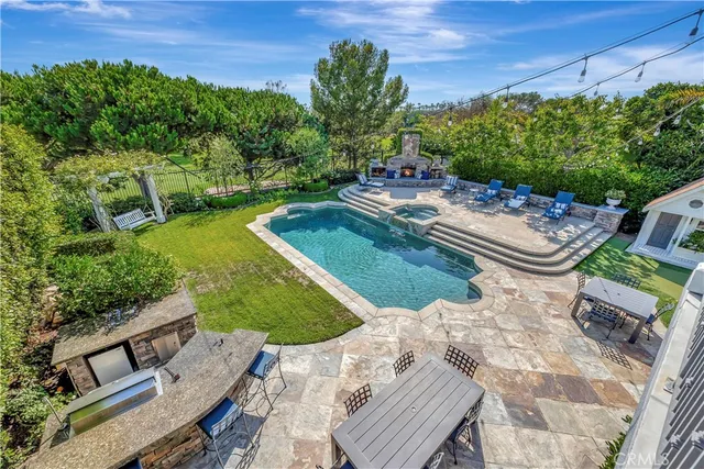 a bedroom with a bed and a large mirror on the dresser