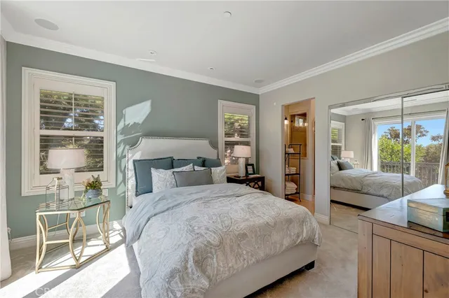 a bathroom with a granite countertop sink a mirror and shower