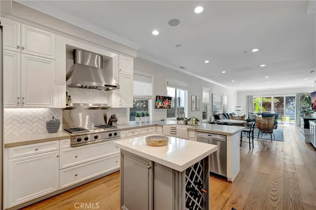a kitchen with a stove a sink and a refrigerator