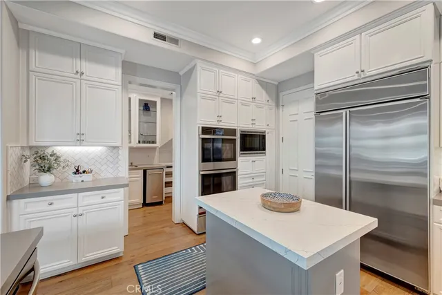 a kitchen with a sink and a refrigerator