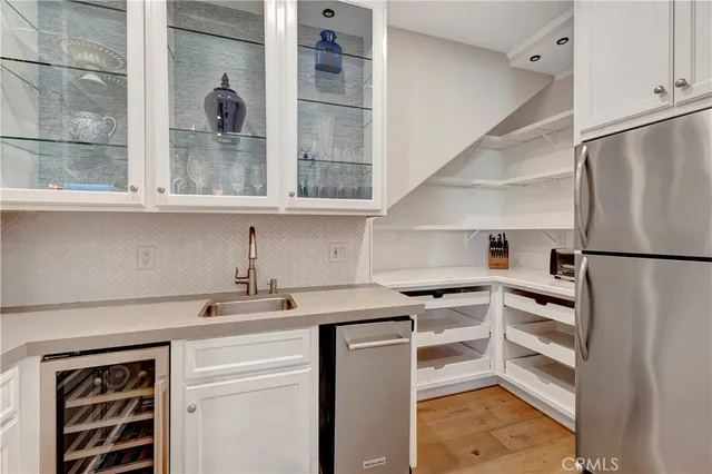 a living room with fireplace furniture and a large window