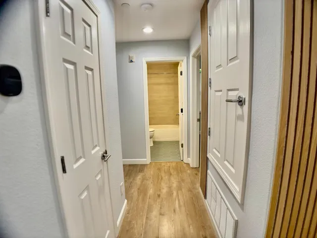 a view of an empty room with a window