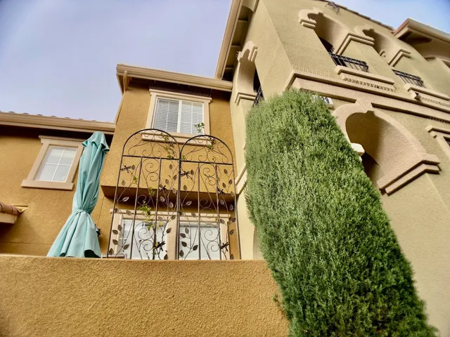 a view of a front of a house with a small yard