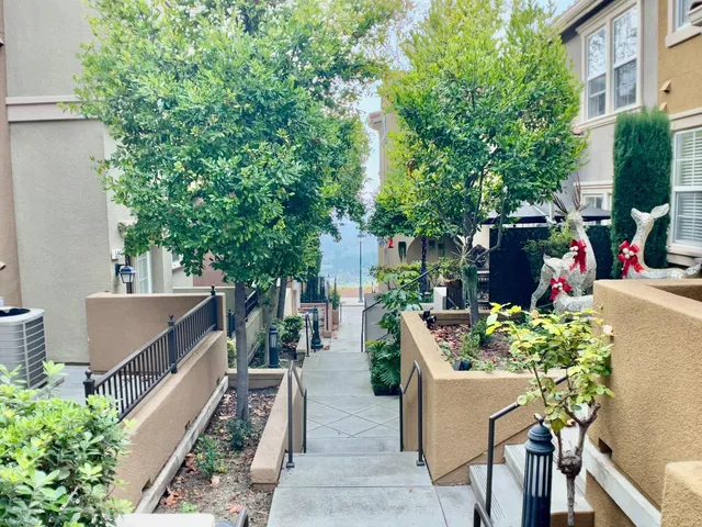 a view of a house with a flower garden
