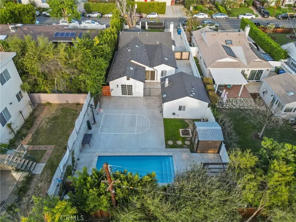 an aerial view of a house with a yard