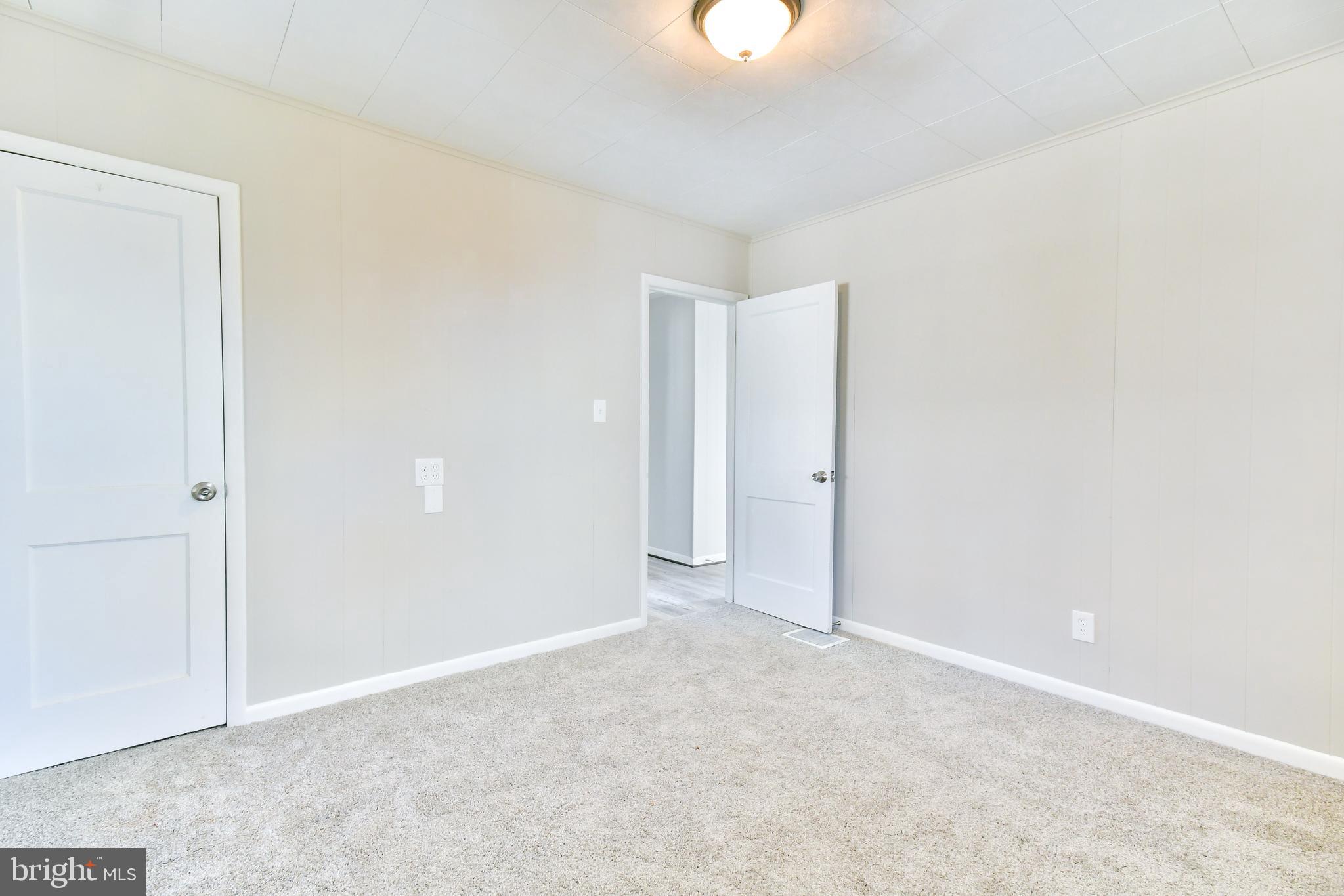 7618 Spruce Road Baltimore, MD 21222 - Photo 11 of 42 an empty room with a empty space