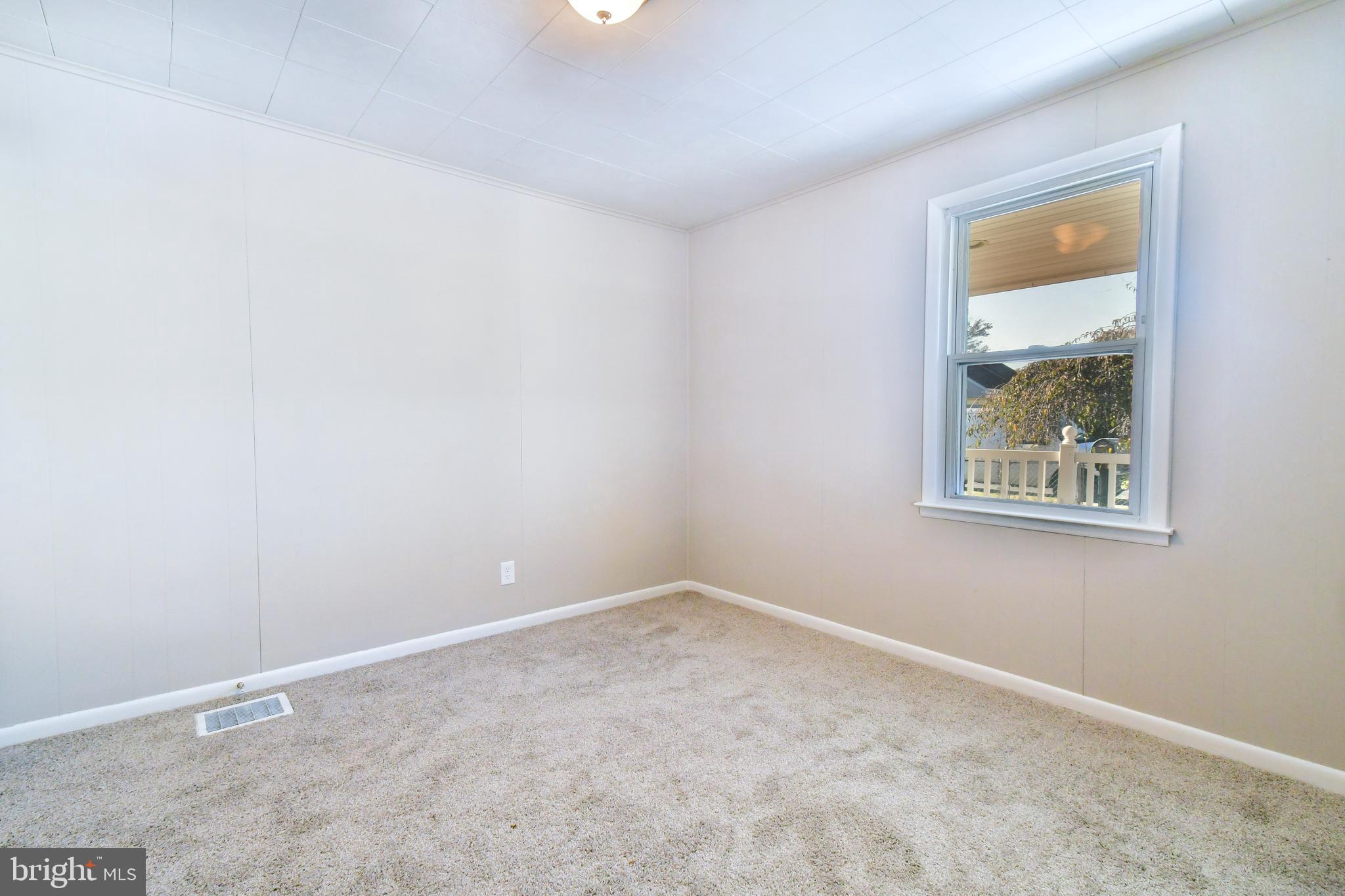 7618 Spruce Road Baltimore, MD 21222 - Photo 12 of 42 an empty room with a window