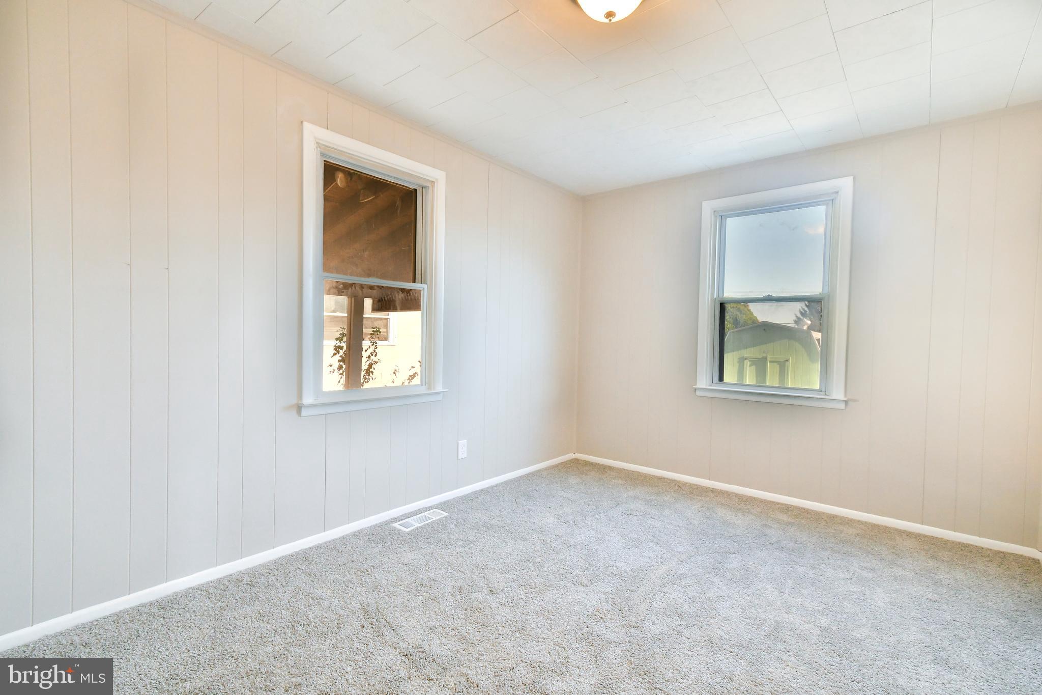 7618 Spruce Road Baltimore, MD 21222 - Photo 13 of 42 an empty room with a window