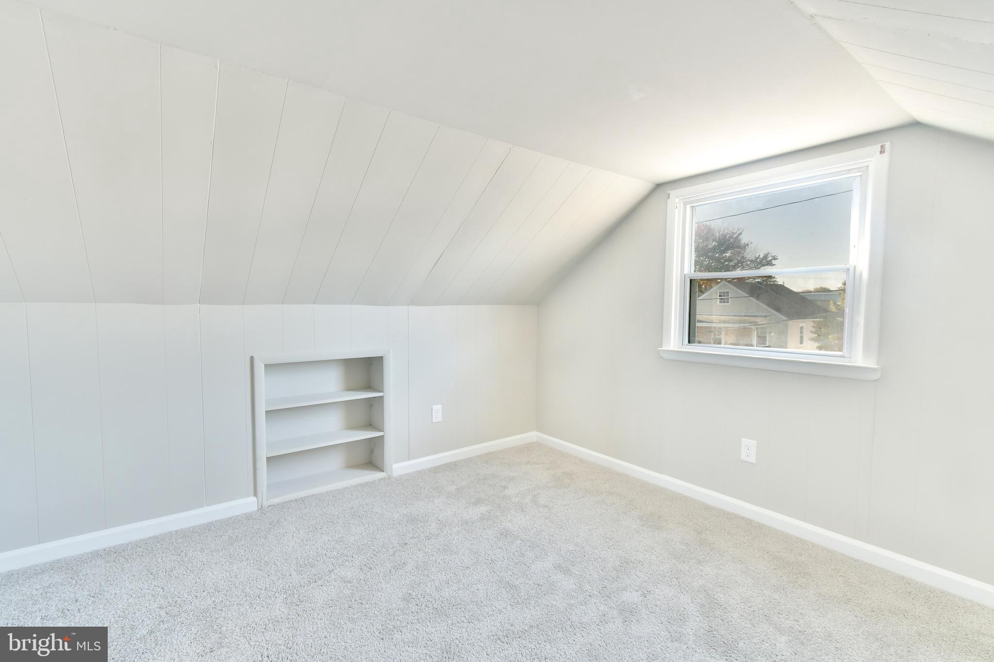 7618 Spruce Road Baltimore, MD 21222 - Photo 22 of 42 an empty room with a workspace