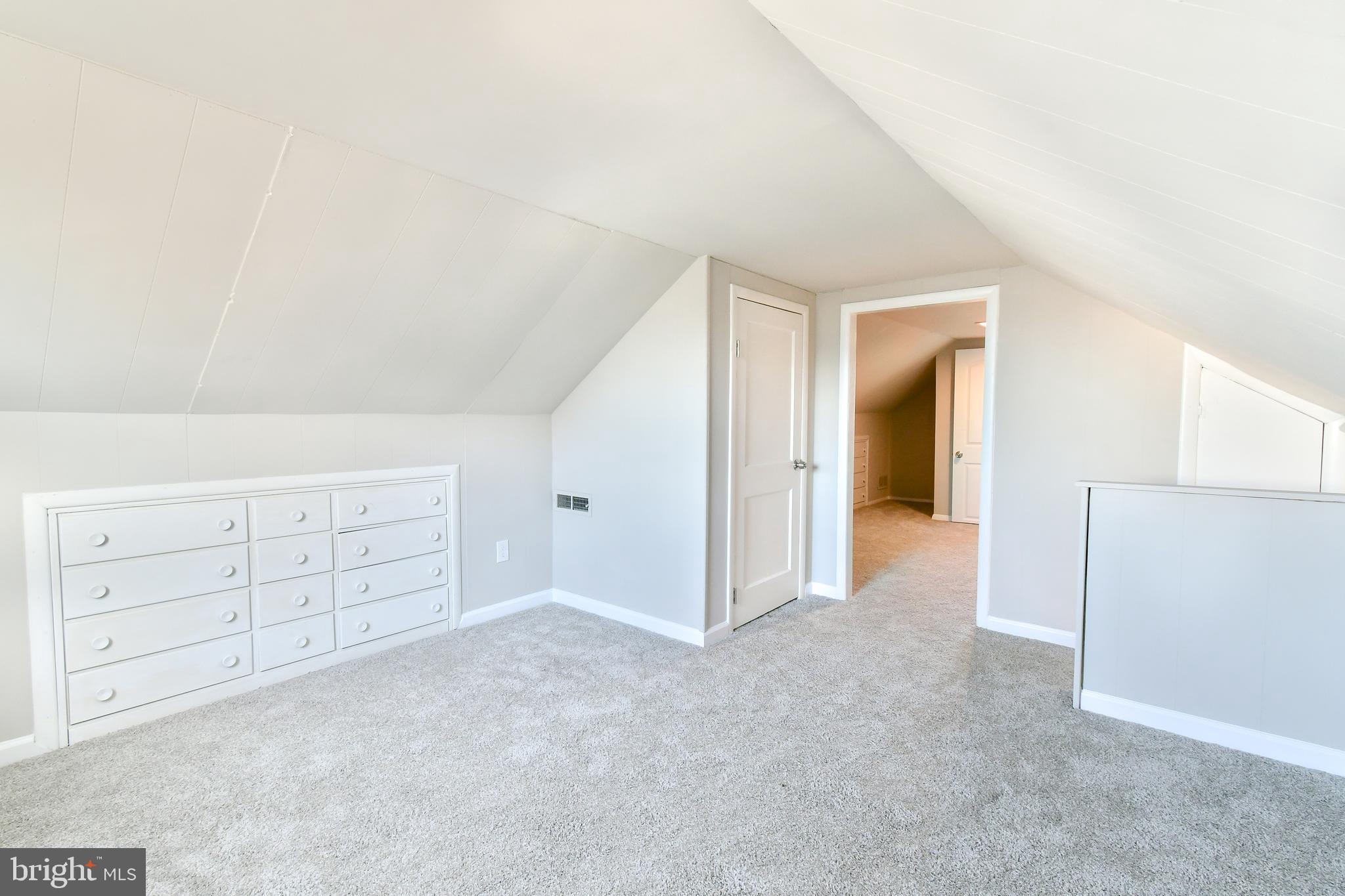 7618 Spruce Road Baltimore, MD 21222 - Photo 23 of 42 an empty room with cabinet and mirrors