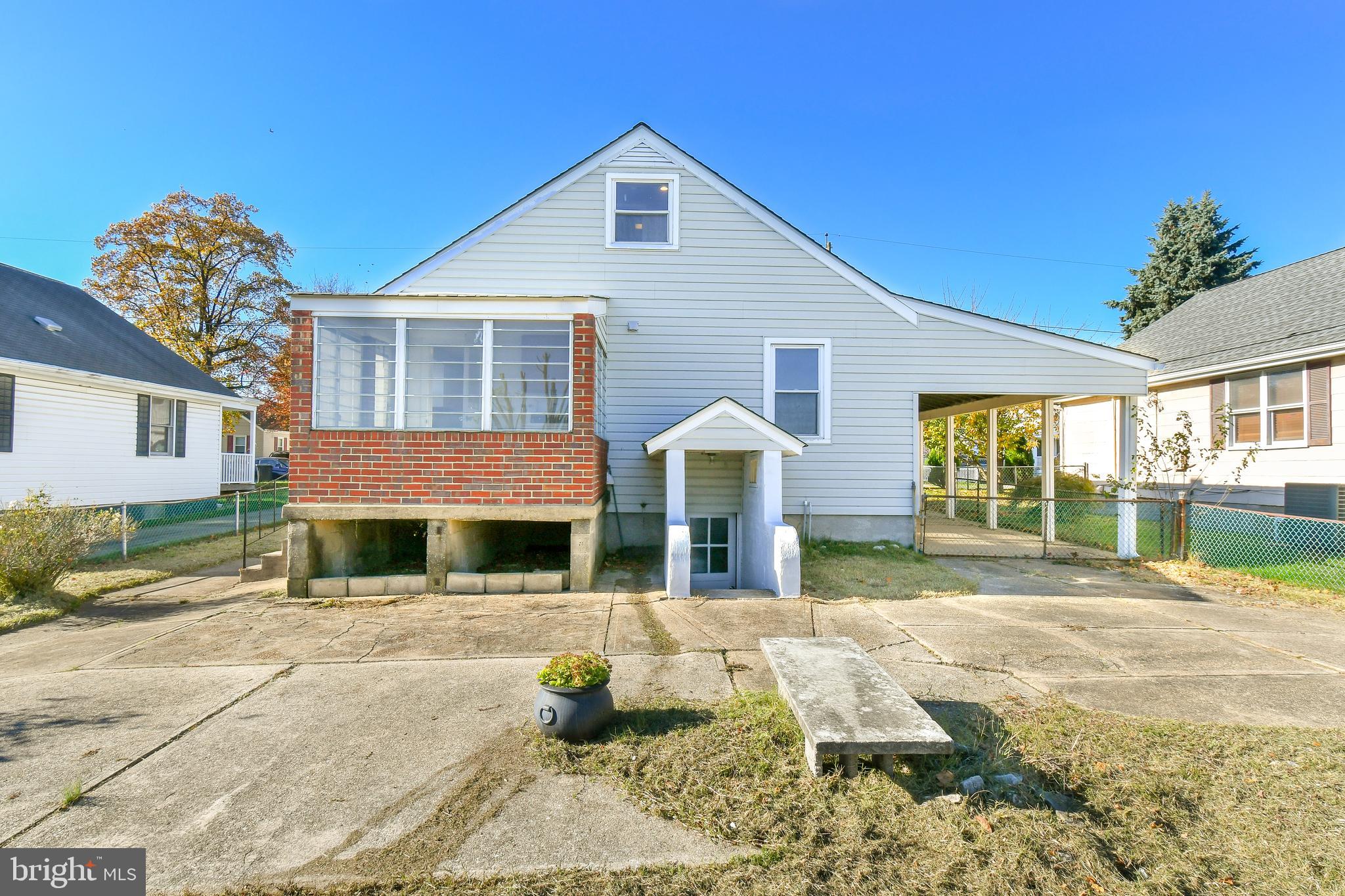 7618 Spruce Road Baltimore, MD 21222 - Photo 39 of 42 a front view of a house with a yard