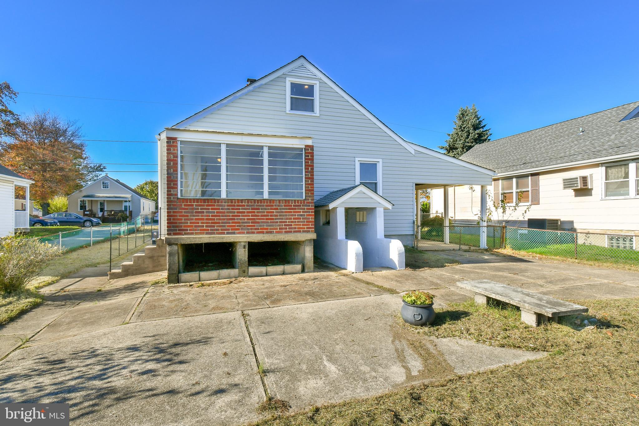 7618 Spruce Road Baltimore, MD 21222 - Photo 40 of 42 a front view of a house with a yard