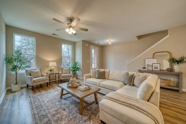 a living room with furniture and a large window