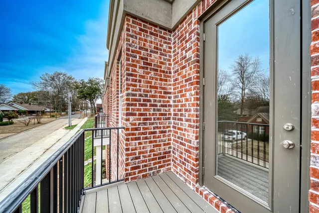 a view of balcony with wooden floor