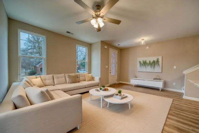 a living room with furniture and a large window