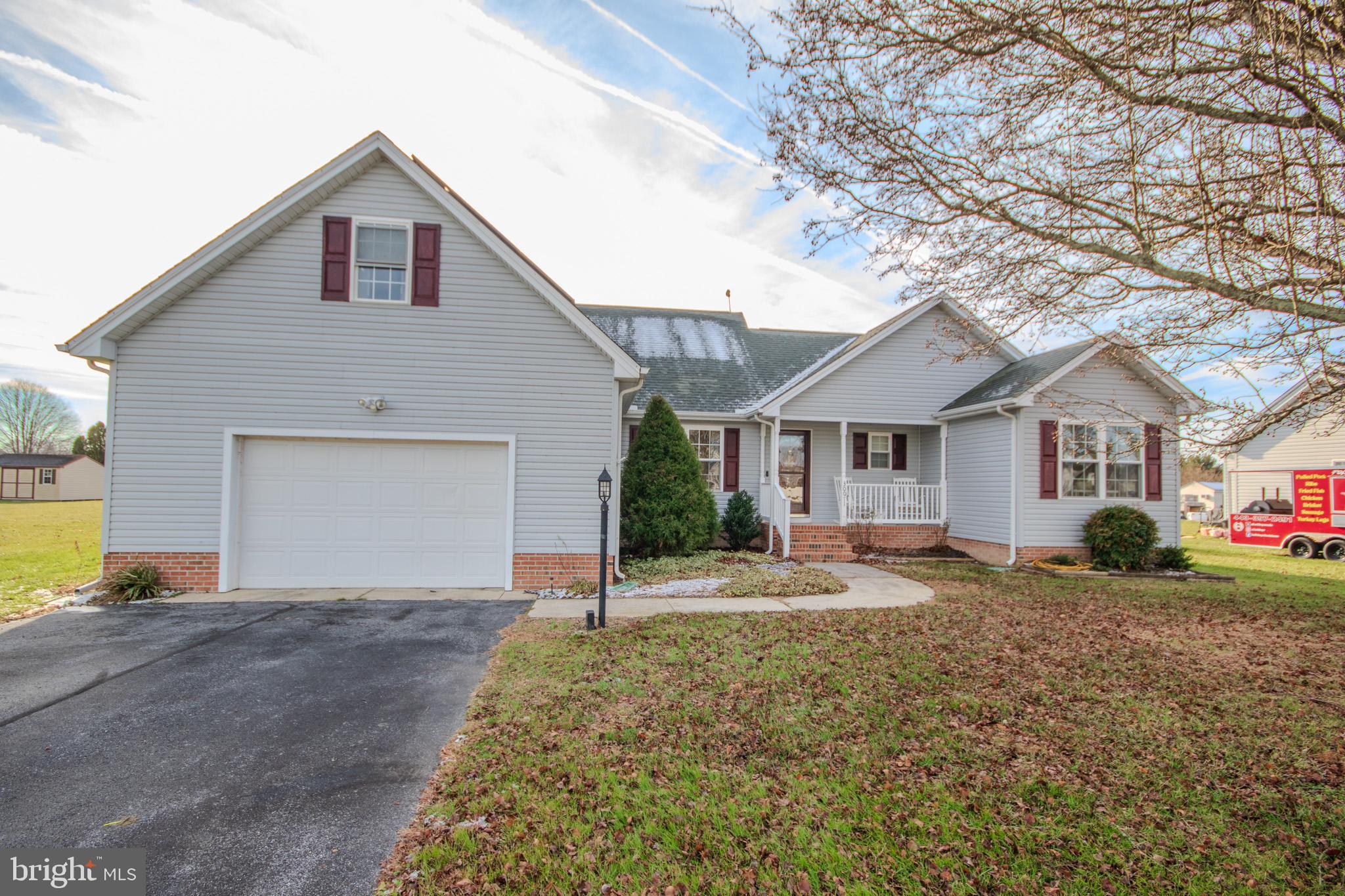 30071 Deanwood Road Princess Anne, MD 21853 - Photo 1 of 37 a front view of a house with a yard and garage