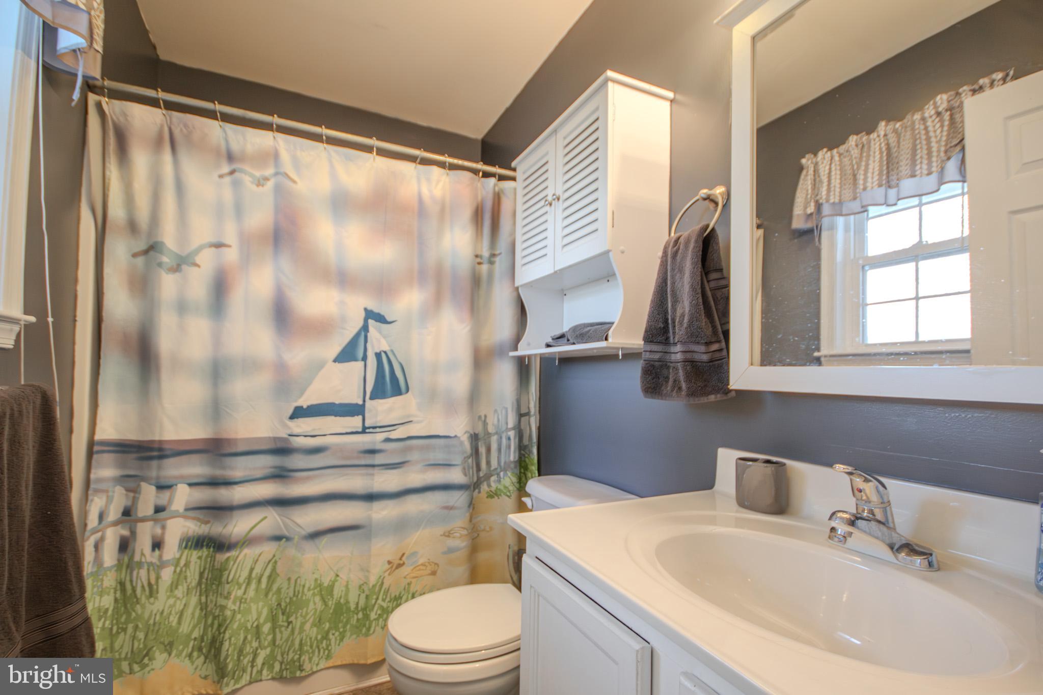 30071 Deanwood Road Princess Anne, MD 21853 - Photo 22 of 37 a bathroom with a sink toilet and shower