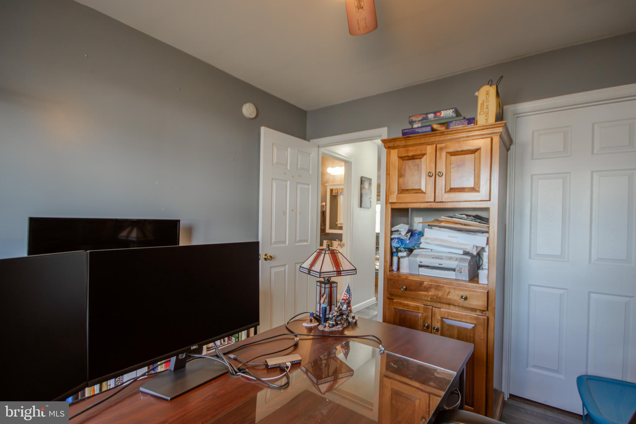 30071 Deanwood Road Princess Anne, MD 21853 - Photo 24 of 37 a workspace with furniture and wooden floor