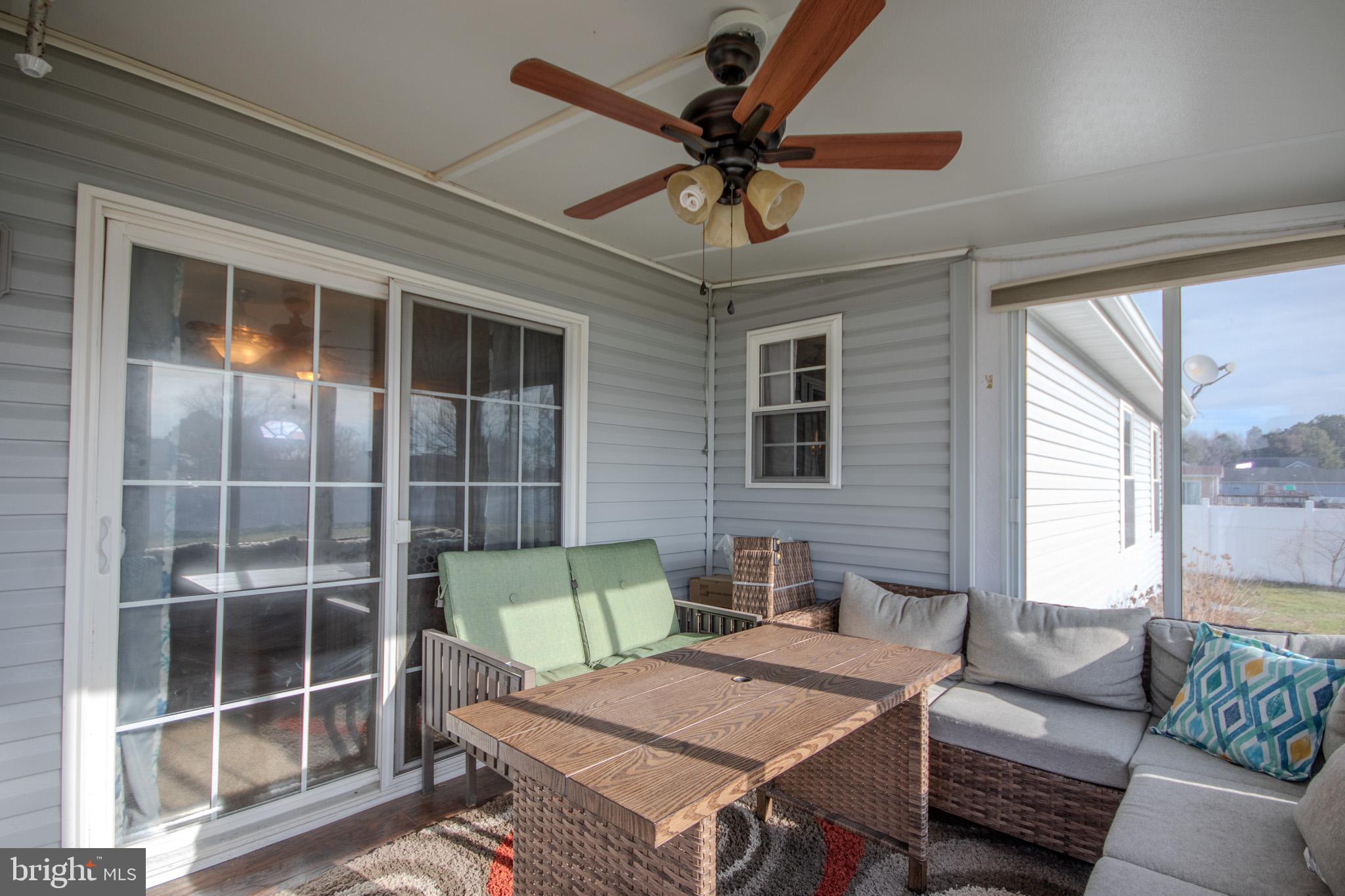 30071 Deanwood Road Princess Anne, MD 21853 - Photo 29 of 37 a living room with furniture and a window