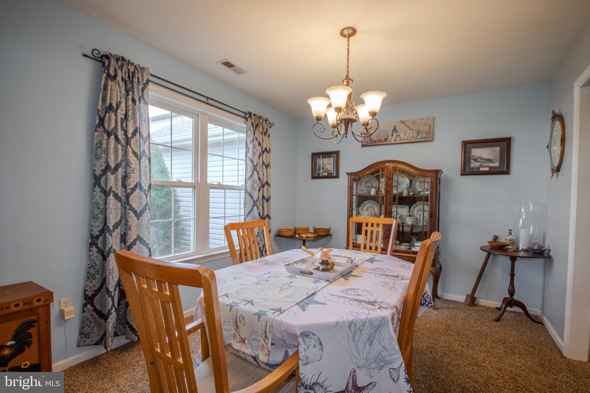 30071 Deanwood Road Princess Anne, MD 21853 - Photo 5 of 37 a view of a dining room with furniture window and outside view