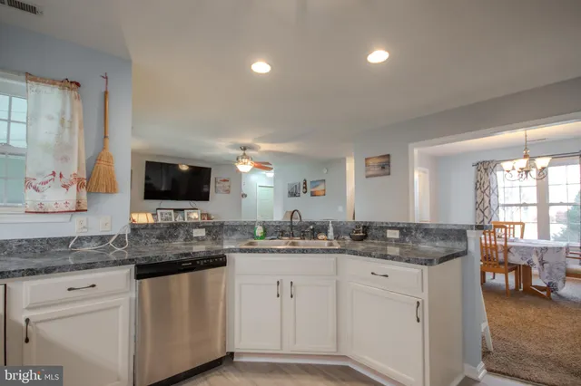 a bathroom with double sink and a mirror