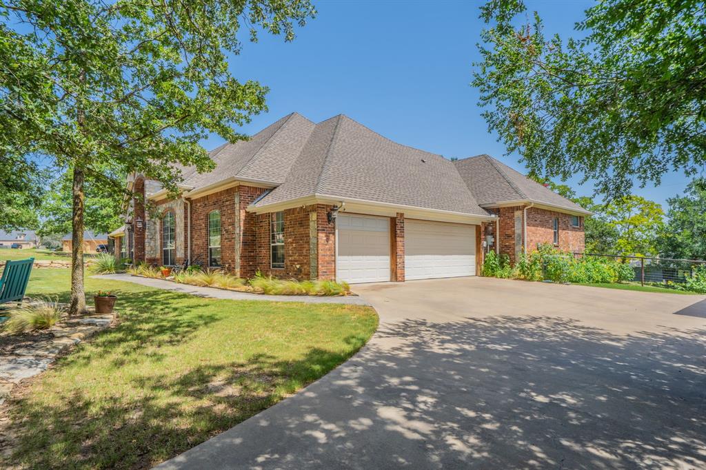 109 Overton Ridge Circle Weatherford, TX 76088 - Photo 2 of 27 Oversized three car garage.