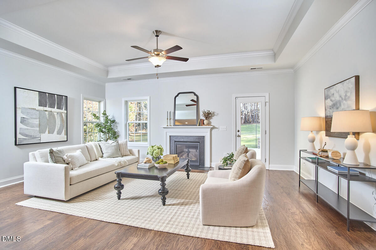 8600 Rowan Oak Court Wake Forest, NC 27587 - Photo 13 of 42 a living room with furniture and a large window