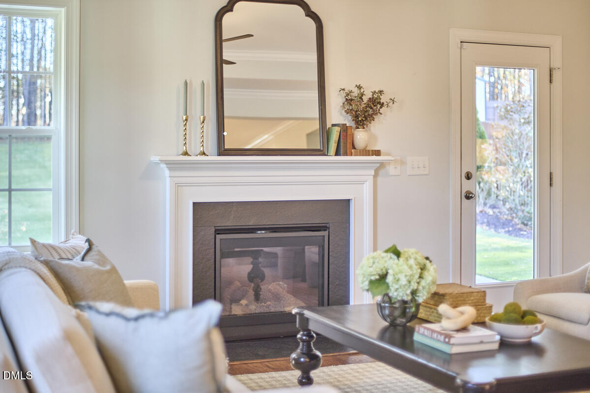 8600 Rowan Oak Court Wake Forest, NC 27587 - Photo 14 of 42 a living room with furniture and a fireplace