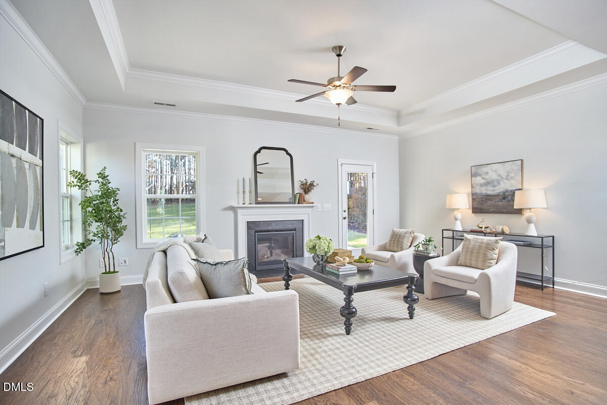 8600 Rowan Oak Court Wake Forest, NC 27587 - Photo 15 of 42 a living room with furniture and a fireplace