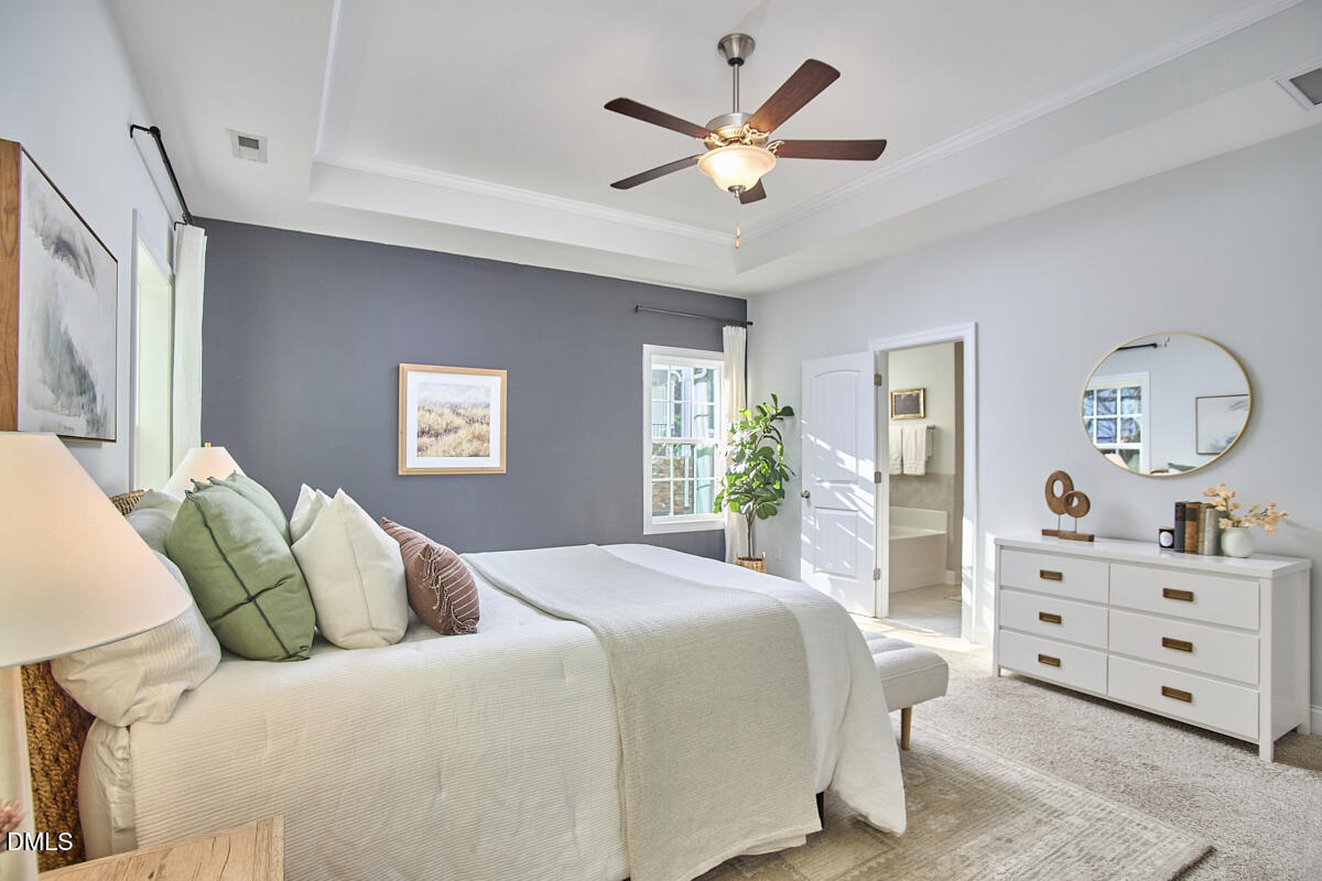 8600 Rowan Oak Court Wake Forest, NC 27587 - Photo 20 of 42 a bedroom with a large bed and a window